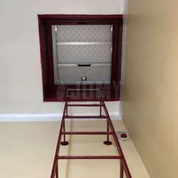 Fixed ladder for hatch access Painted ladder used to access an attic hatch.